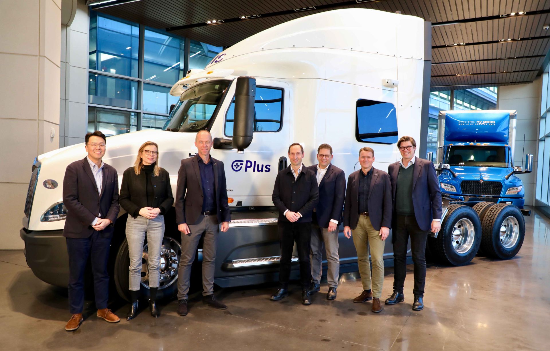 Plus-partnership-People-infront-of-truck
