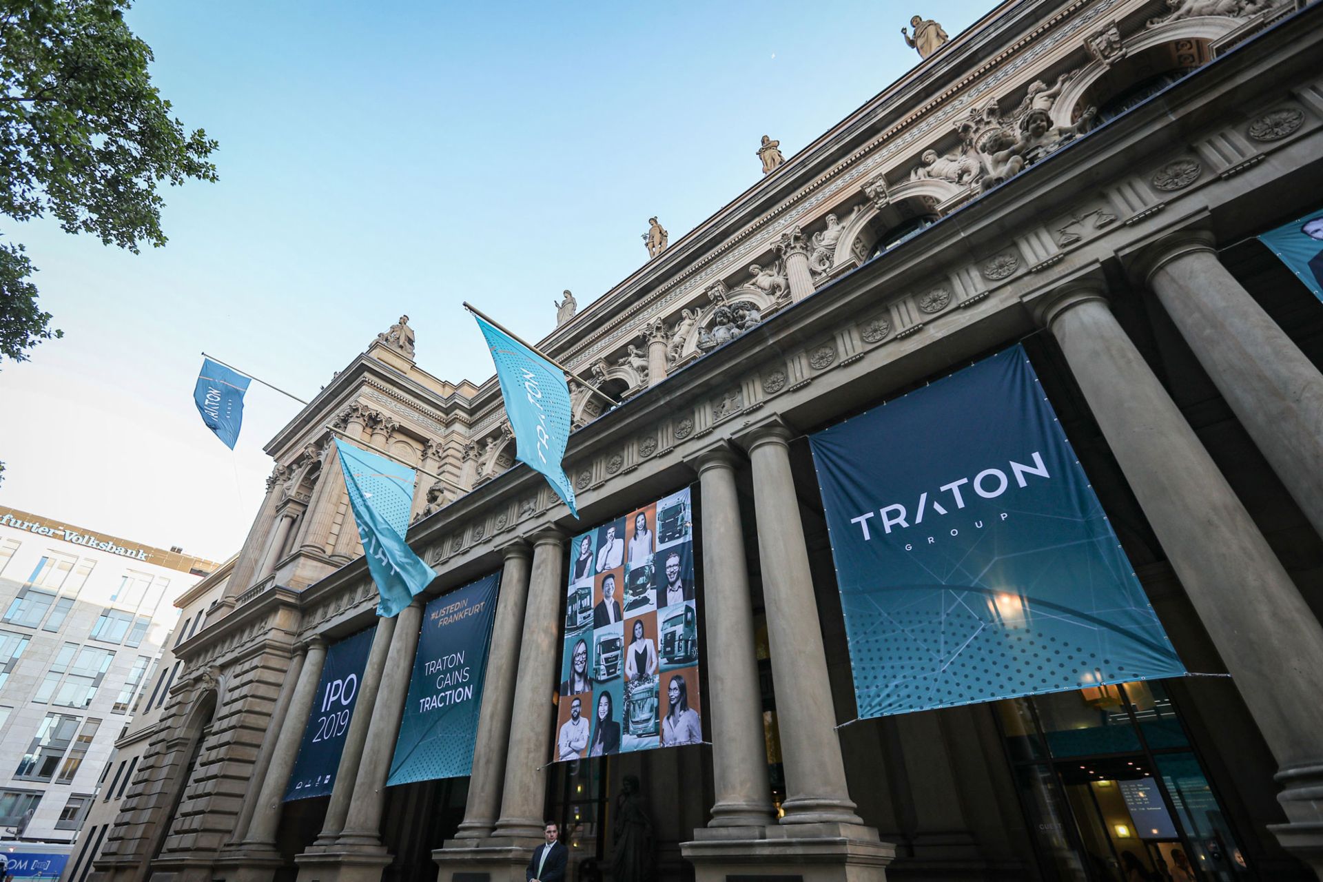Blue TRATON banners hanging in front of the Frankfurt Stock Exchange
                 