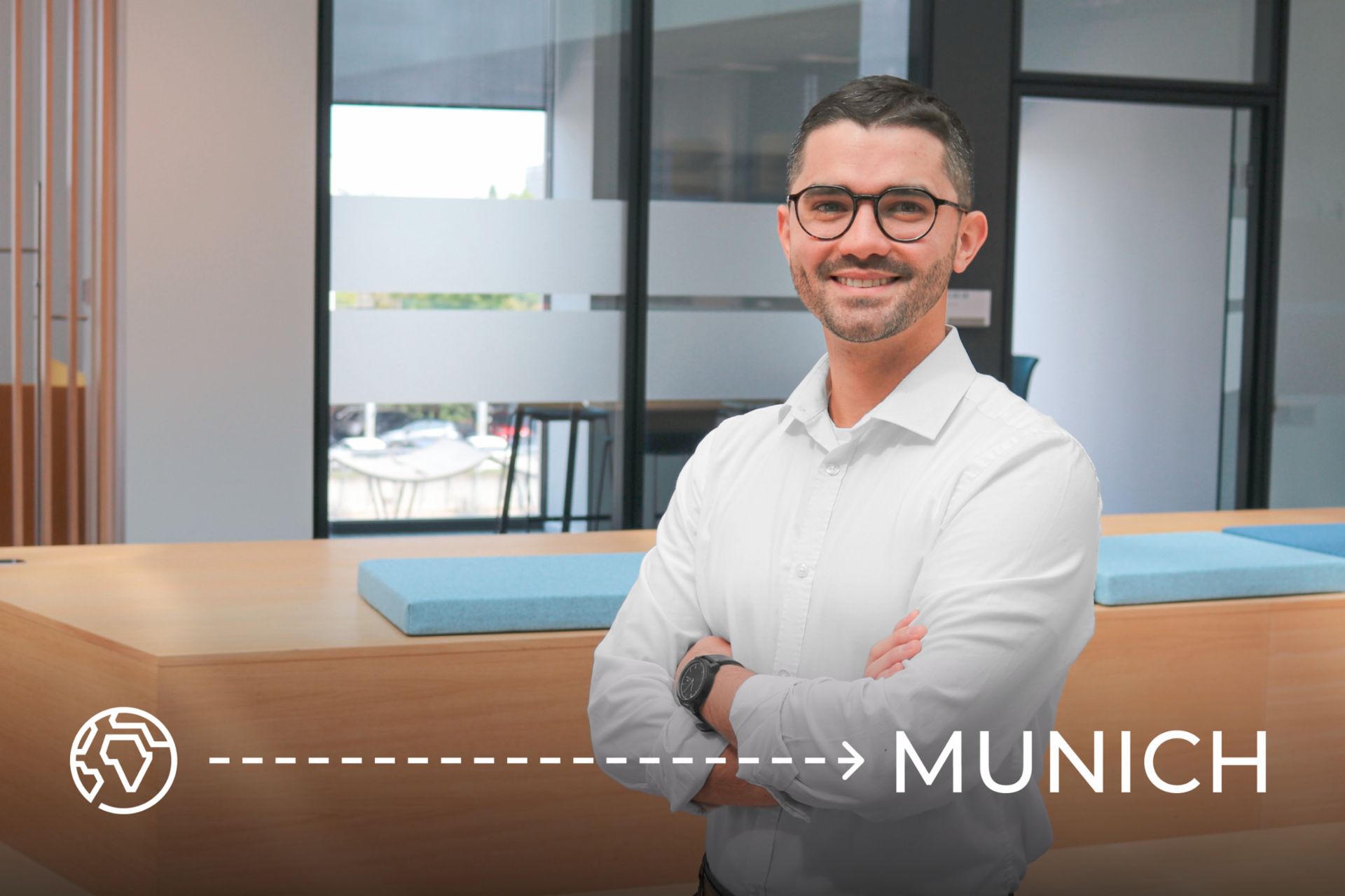 Lucas Antunes walking among trees near the Isar River, with lush nature around Munich in the background.