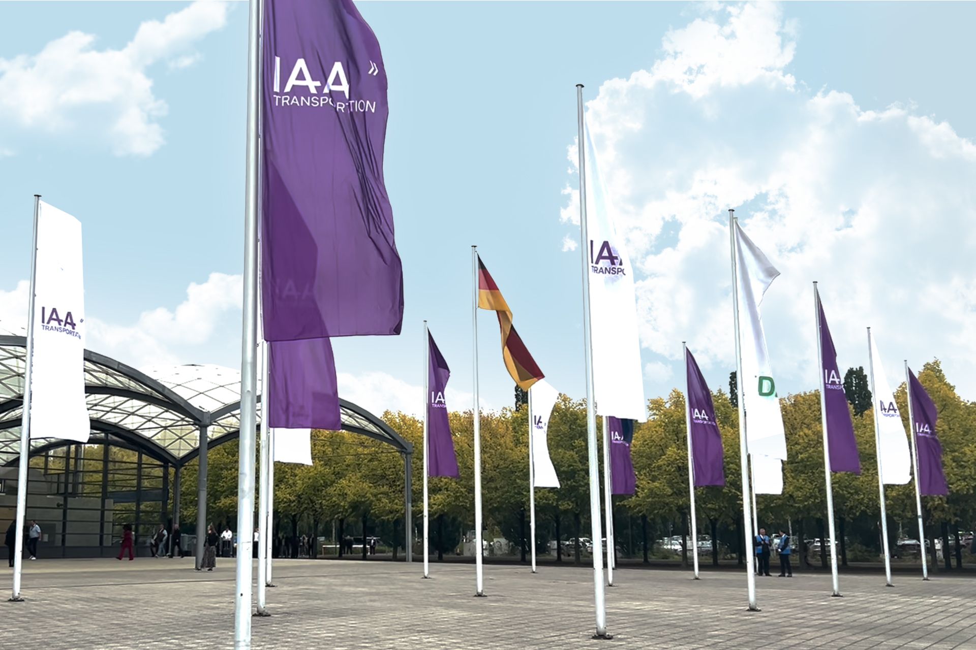 A photo showing multiple flags with the IAA Transportation 2024




                 