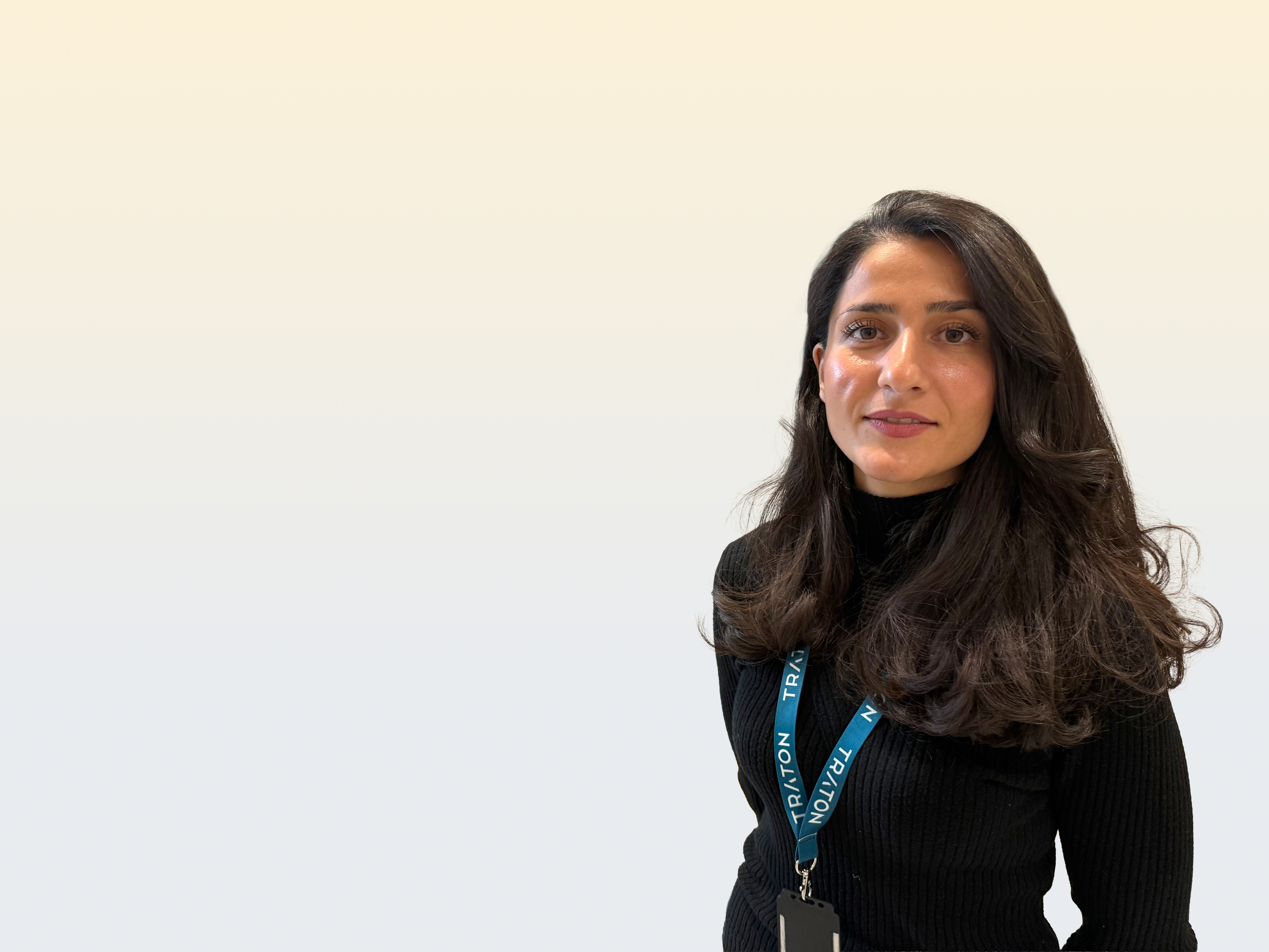  A woman in a black pullover is smiling in the camera.